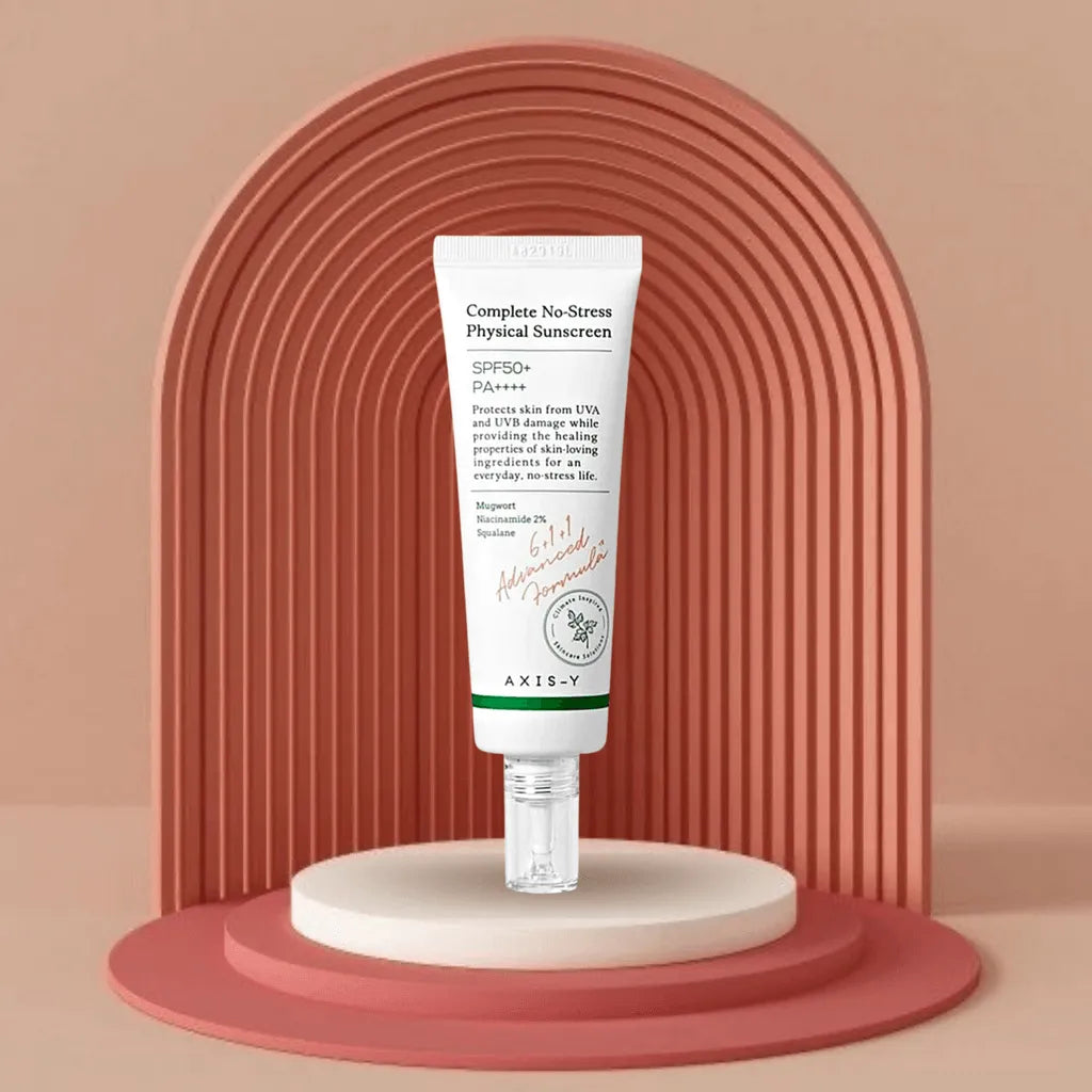 AXIS-Y Complete No-Stress Physical Sunscreen SPF50 tube displayed on podium, Korean skincare