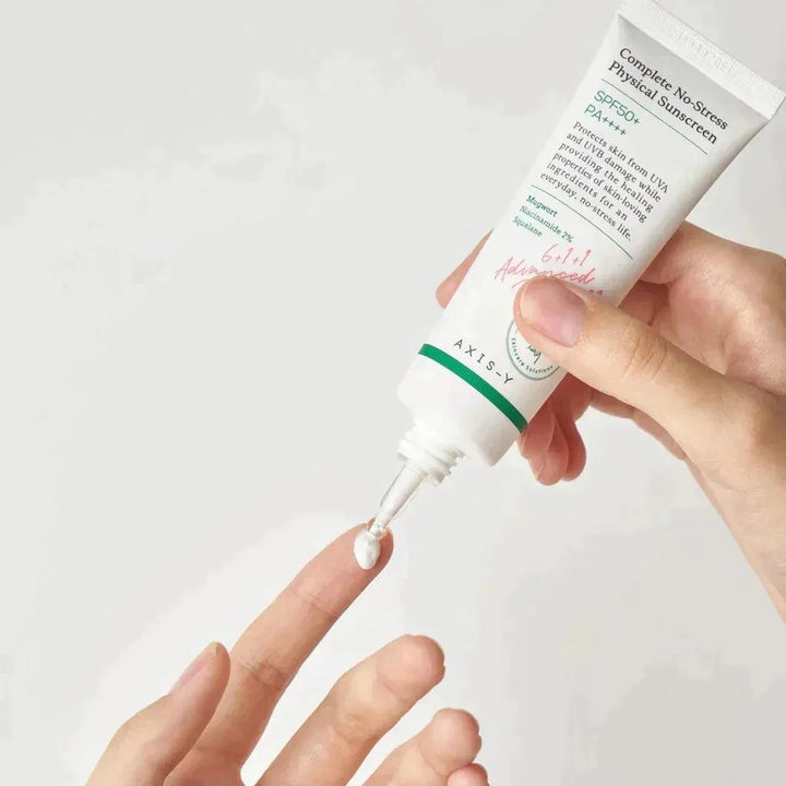 Person applying AXIS-Y Complete No-Stress Physical Sunscreen SPF50 Korean skincare