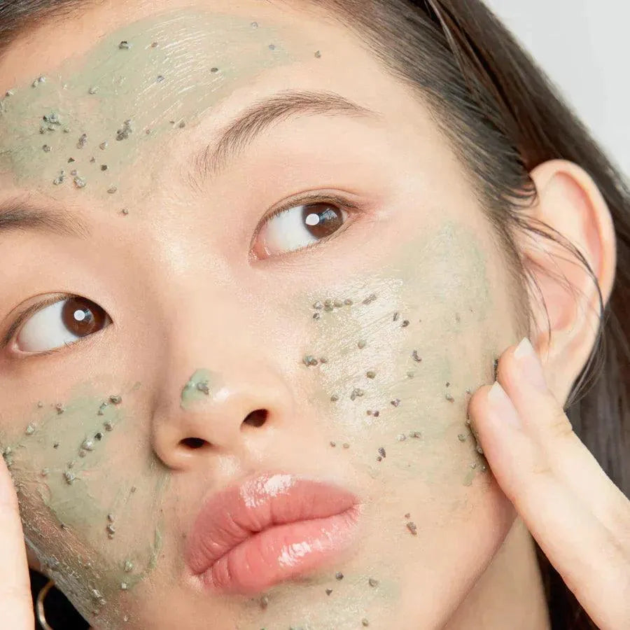 Woman applying Axis-Y Mugwort Pore Clarifying Wash Off Pack Korean skincare mask