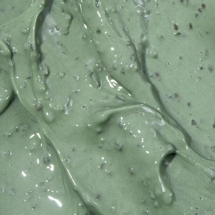Close-up of green Axis-Y Mugwort Pore Clarifying Wash Off Pack Korean skincare mask texture.