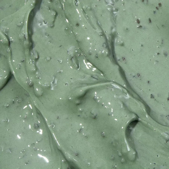 Close-up of green Axis-Y Mugwort Pore Clarifying Wash Off Pack Korean skincare mask texture.
