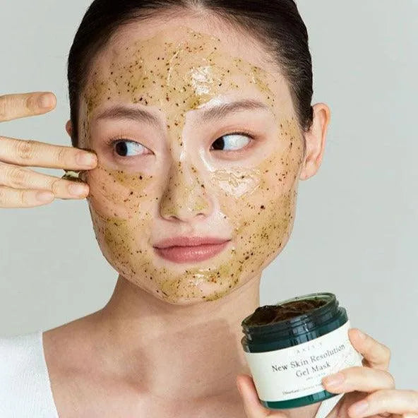 Woman applying AXIS-Y New Skin Resolution Gel Mask, Korean skincare at Me Time Groningen.