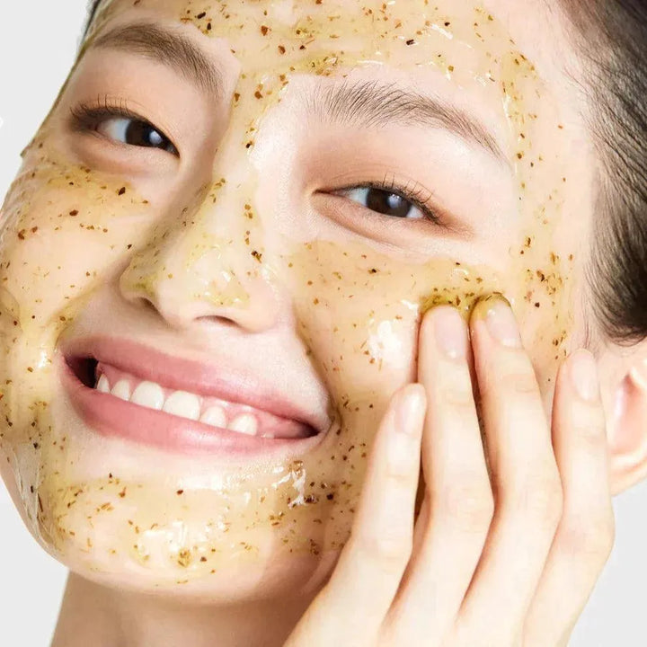 Smiling woman applying Korean gel face mask, skincare product at Me Time Groningen