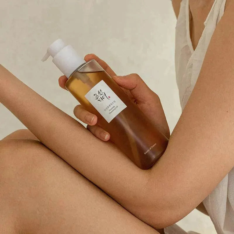 Beauty of Joseon Ginseng Cleansing Oil bottle held by person, Korean skincare at Me Time Groningen