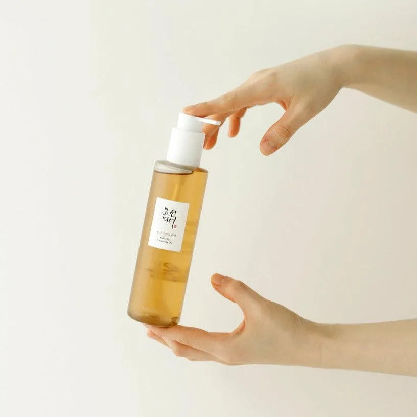 Hand holding Beauty of Joseon Ginseng Cleansing Oil bottle, Korean skincare at Me Time Groningen