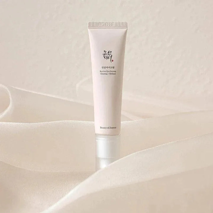 Beauty of Joseon Revive Eye Serum tube on soft beige fabric, Korean skincare Netherlands
