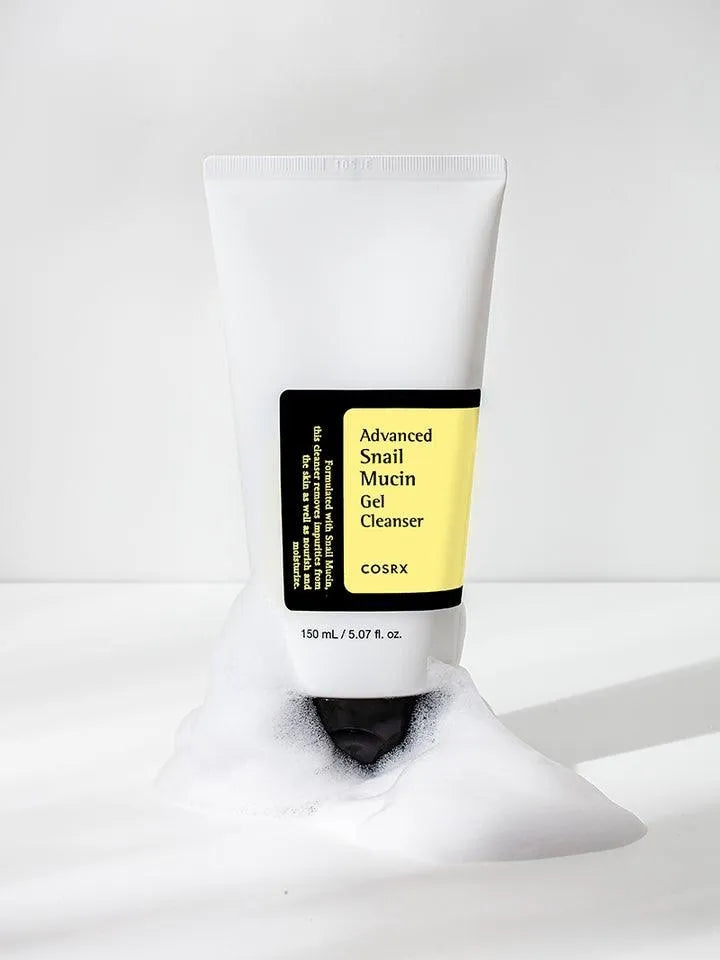 COSRX Advanced Snail Mucin Gel Cleanser on white background with foamy lather, Korean skincare