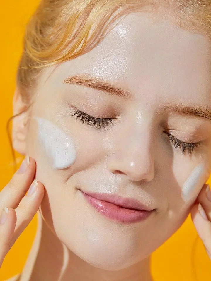 Woman applying COSRX snail mucin gel cleanser, Korean skincare, radiant skin, Me Time Groningen