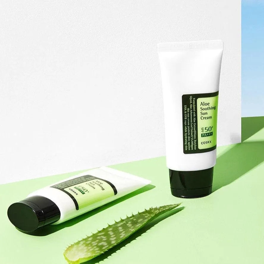COSRX Aloe Soothing Sun Cream SPF50 tubes with aloe leaf on green background at Me Time Groningen