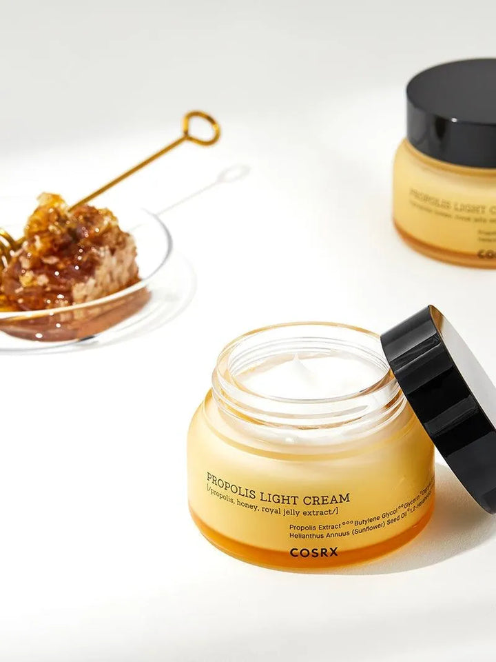 COSRX Propolis Light Cream jar with honey and skincare props, Korean skincare at Me Time Groningen