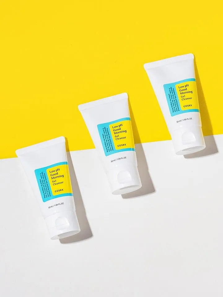 Three COSRX Low pH Good Morning Gel Cleanser tubes on yellow and white background, Korean skincare
