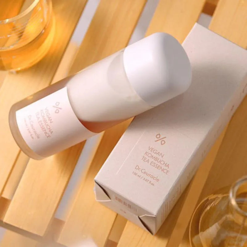 Dr. Ceuracle Vegan Kombucha Tea Essence bottle and box on wooden table, Korean skincare Nederland