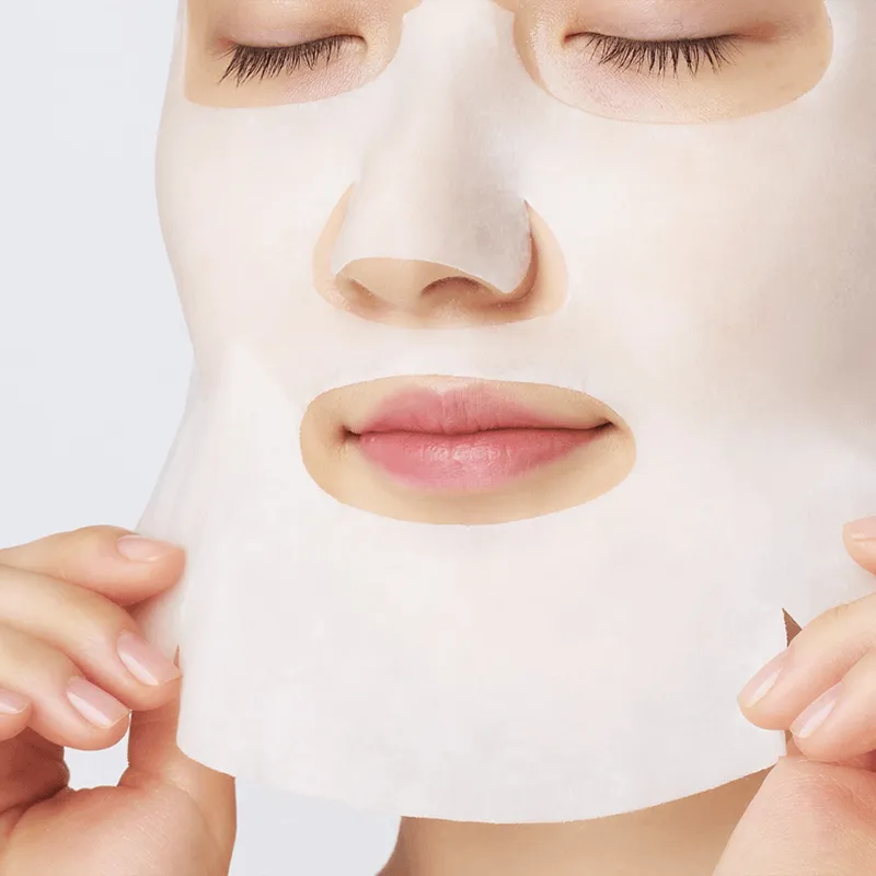 Woman applying Dr. Jart Ceramidin sheet mask, Korean skincare at Me Time Groningen