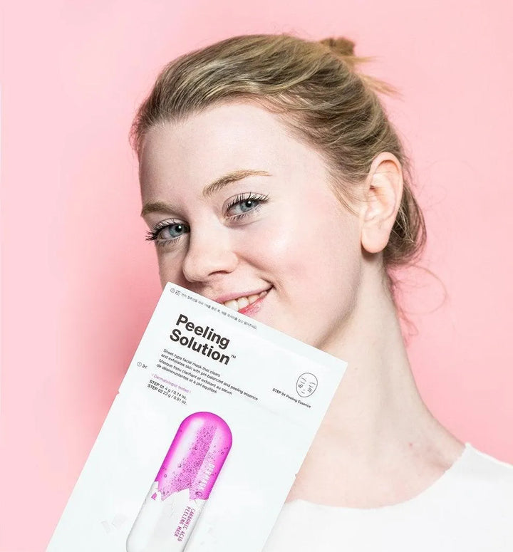 Woman smiling with Dr. Jart+ Peeling Solution mask, Korean skincare Netherlands, Me Time Groningen