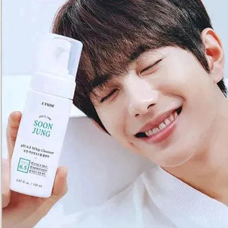 Person smiling and holding Etude House Soon Jung pH 6.5 Whip Cleanser, Korean skincare at Me Time Groningen.
