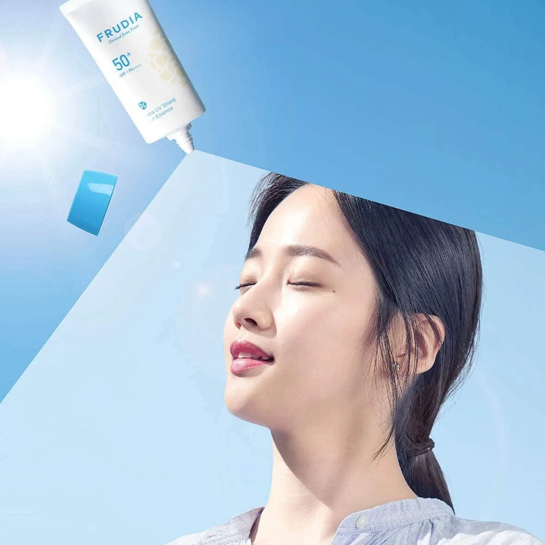 Woman enjoying sunlight with Frudia Ultra UV Shield Sun Essence SPF 50+, Korean skincare Nederland