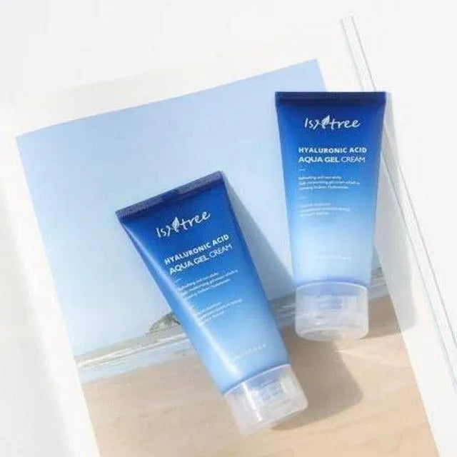 Isntree Hyaluronic Acid Aqua Gel Cream tubes on a beach photo, Korean skincare Me Time Groningen