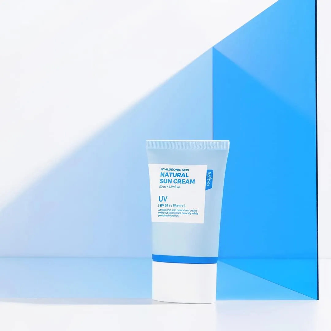 Isntree Hyaluronic Acid Natural Sun Cream tube on blue background, Korean skincare at Me Time Groningen
