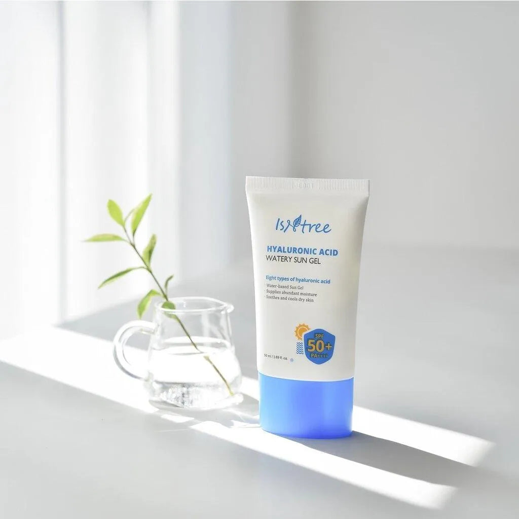 Isntree Hyaluronic Acid Watery Sun Gel SPF 50+ on a white table with sunlight, Korean skincare product at Me Time Groningen
