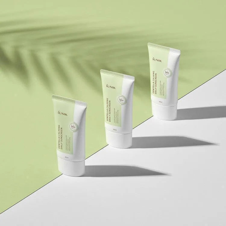 iUNIK Centella Calming Daily Sunscreen SPF50+ tubes on a green and white background, Korean skincare Nederland