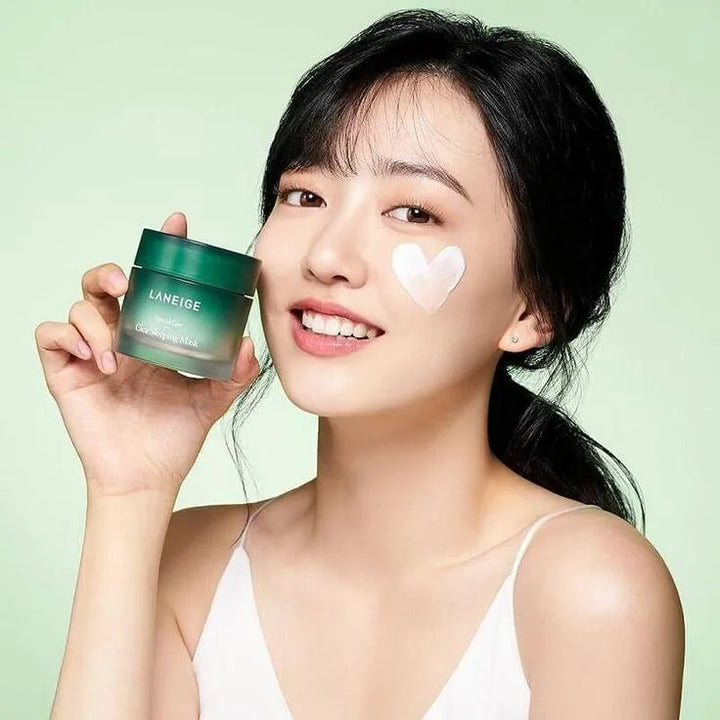 Smiling woman holding Laneige Cica Sleeping Mask, Korean skincare product at Me Time Groningen