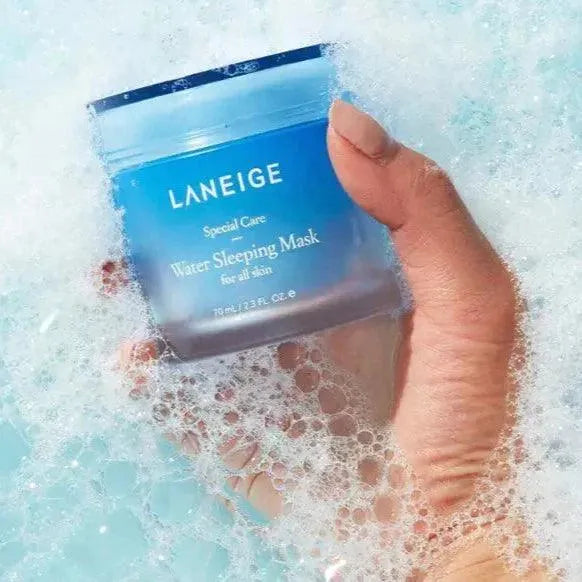 Hand holding Laneige Water Sleeping Mask jar in a bubbly bath, Korean skincare Me Time Groningen
