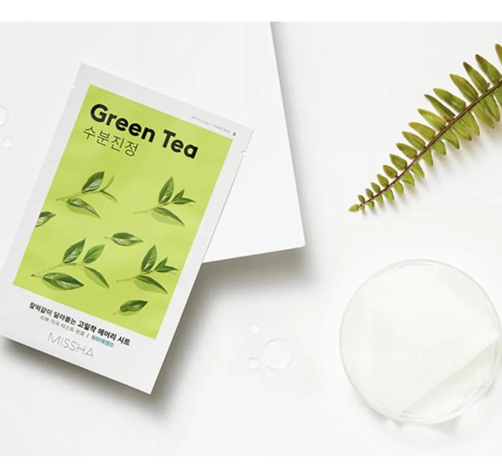 Missha Airy Fit Green Tea sheet mask on white background with leaf, Korean skincare at Me Time Groningen
