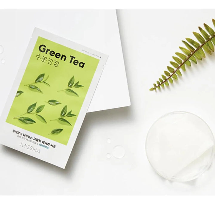 Missha Airy Fit Green Tea sheet mask on white background with leaf, Korean skincare at Me Time Groningen