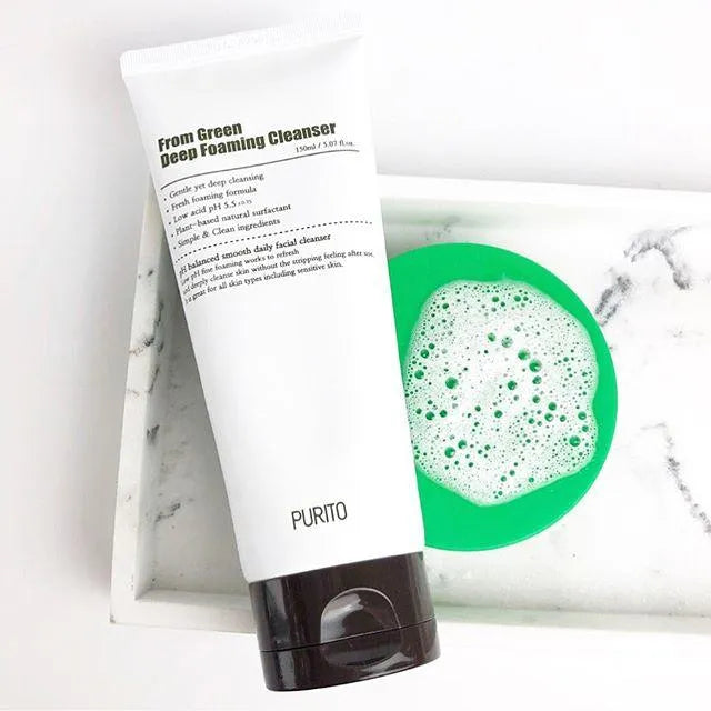 Purito From Green Deep Foaming Cleanser tube with foam on white marble, Korean skincare Netherlands