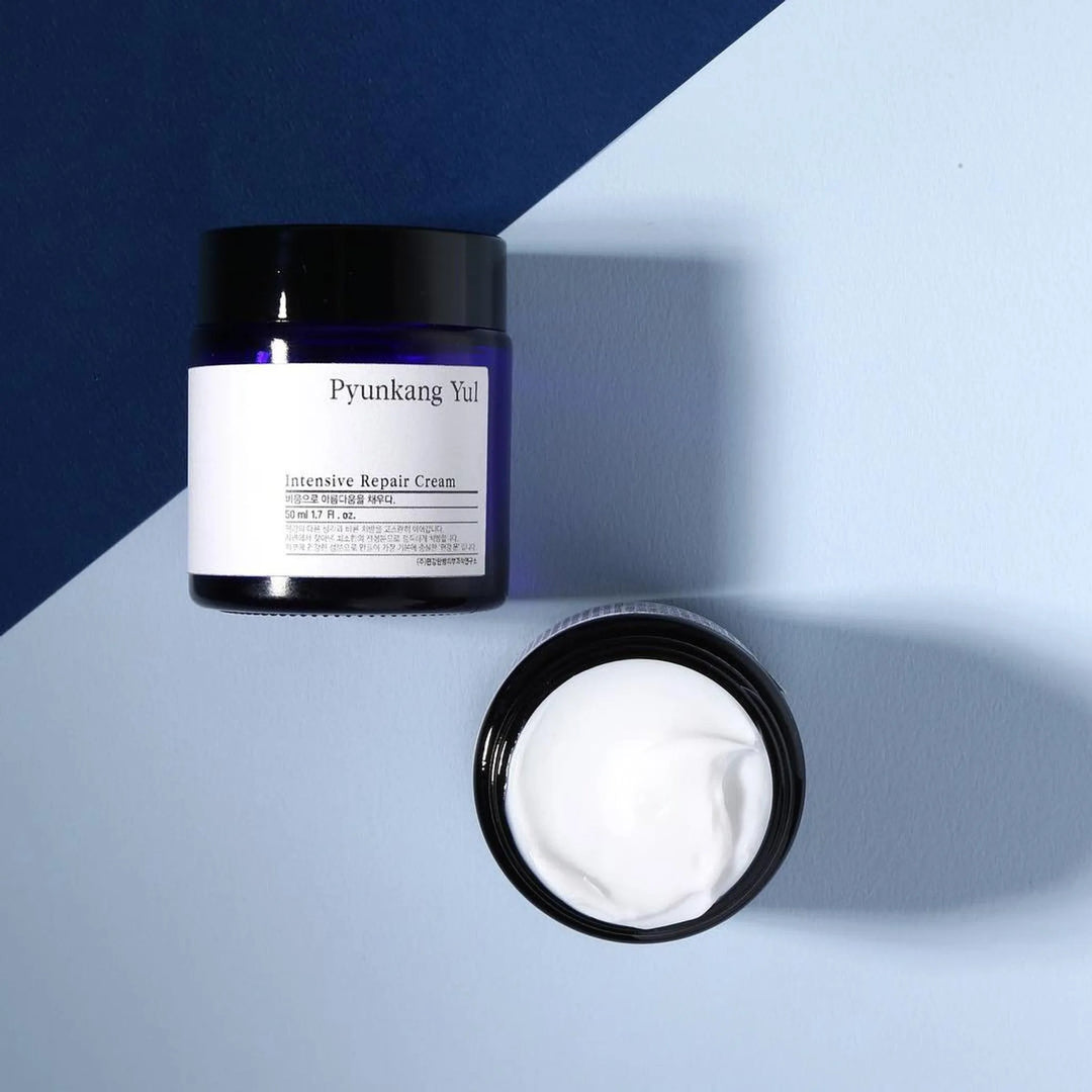 Pyunkang Yul Intensive Repair Cream jar and open cream on modern blue background, Korean skincare