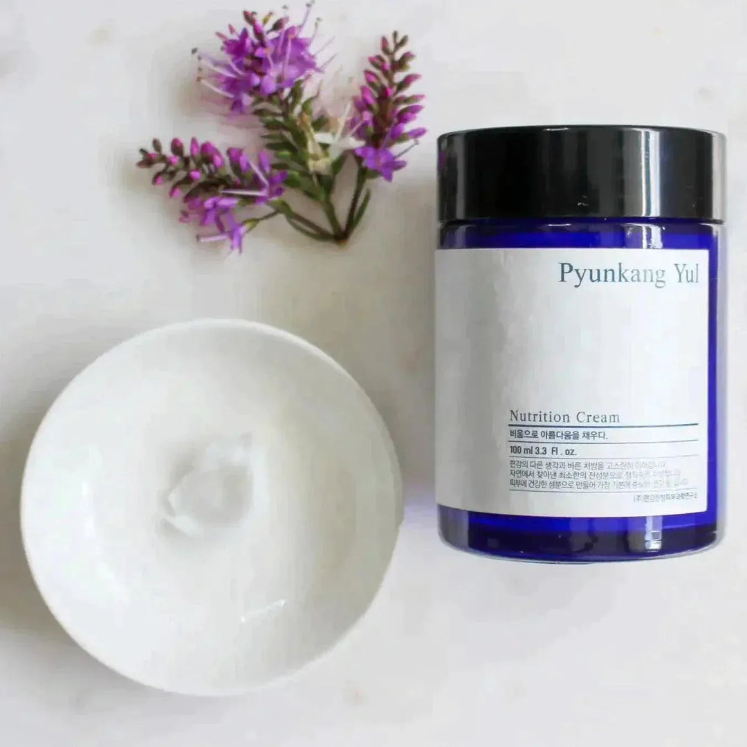 Pyunkang Yul Nutrition Cream jar with open lid and flowers, Korean skincare at Me Time Groningen