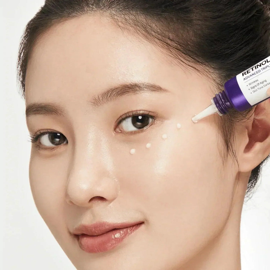 Woman applying Some By Mi Retinol Intense Advanced Triple Action Eye Cream, Korean skincare