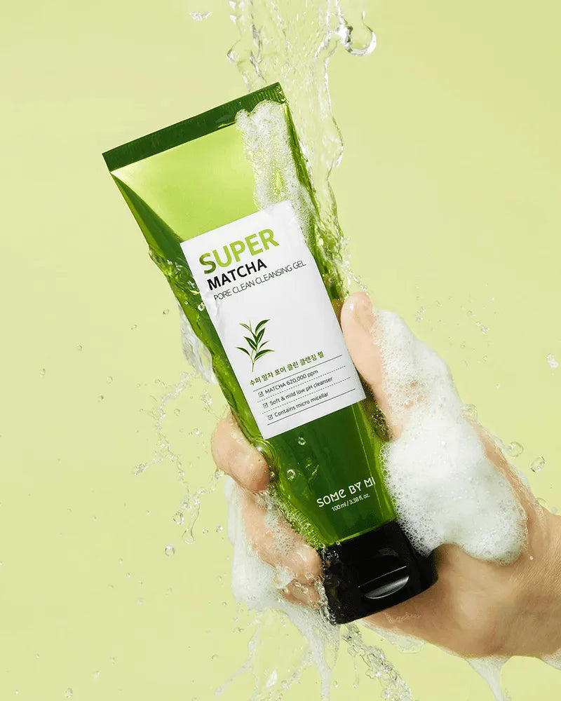 Hand holding Some By Mi Super Matcha Pore Clean Cleansing Gel with foam, Korean skincare product