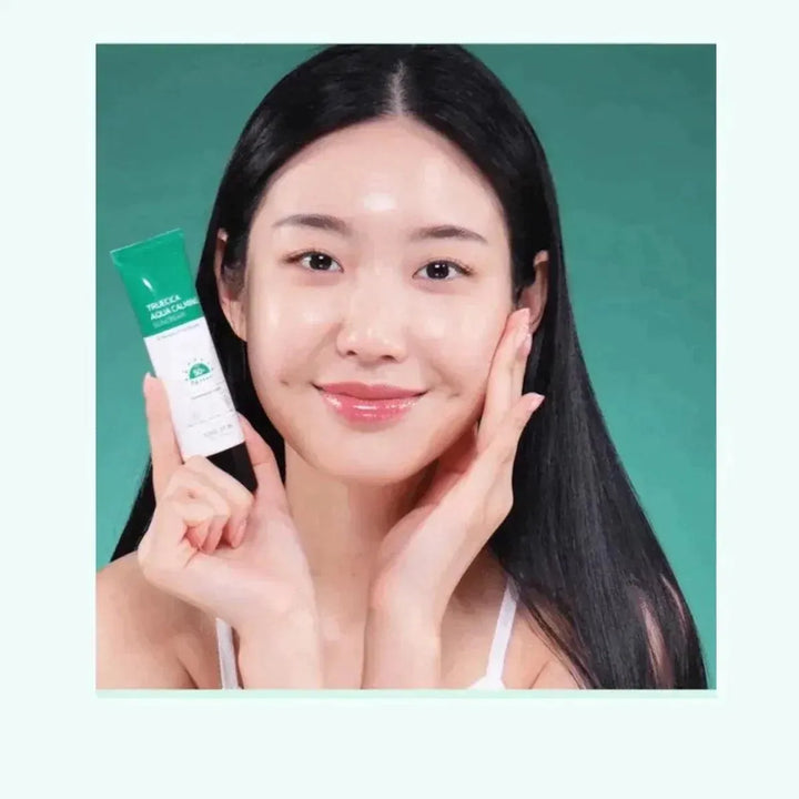Woman holding Some By Mi Truecica Aqua Calming Sun Cream, promoting Korean skincare