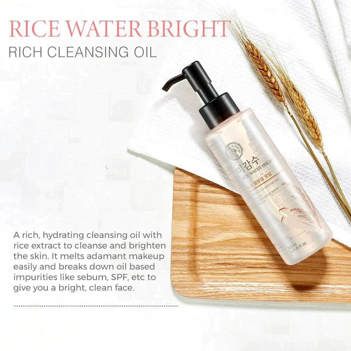 The Face Shop Rice Water Bright Rich Cleansing Oil bottle on wooden tray, Korean skincare.